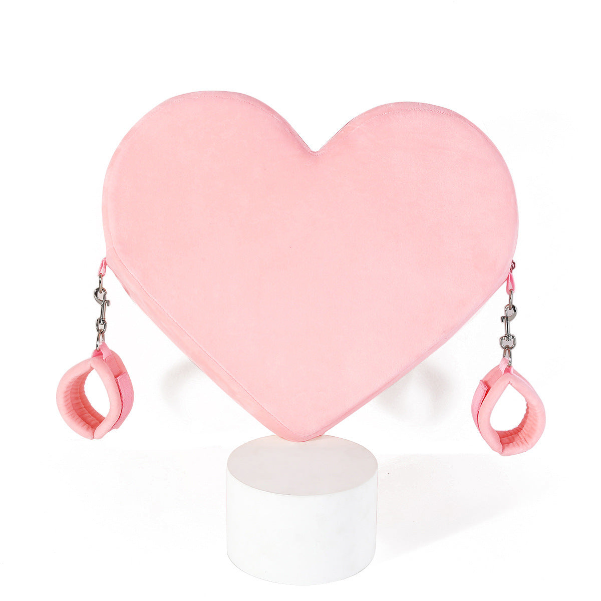 Heart-shaped pose assistance pillow with handcuffed